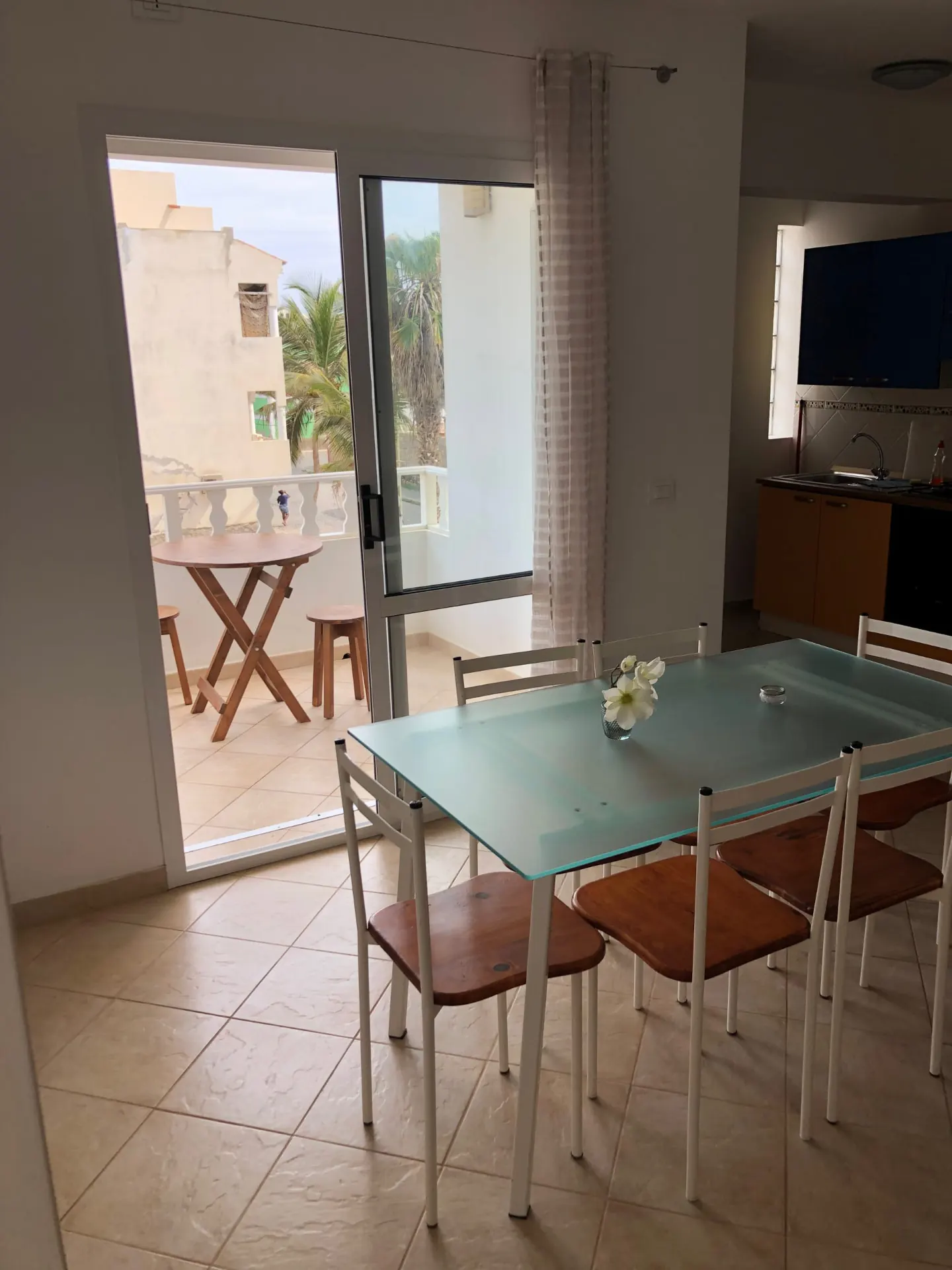 São Vicente — dining table beside the balcony