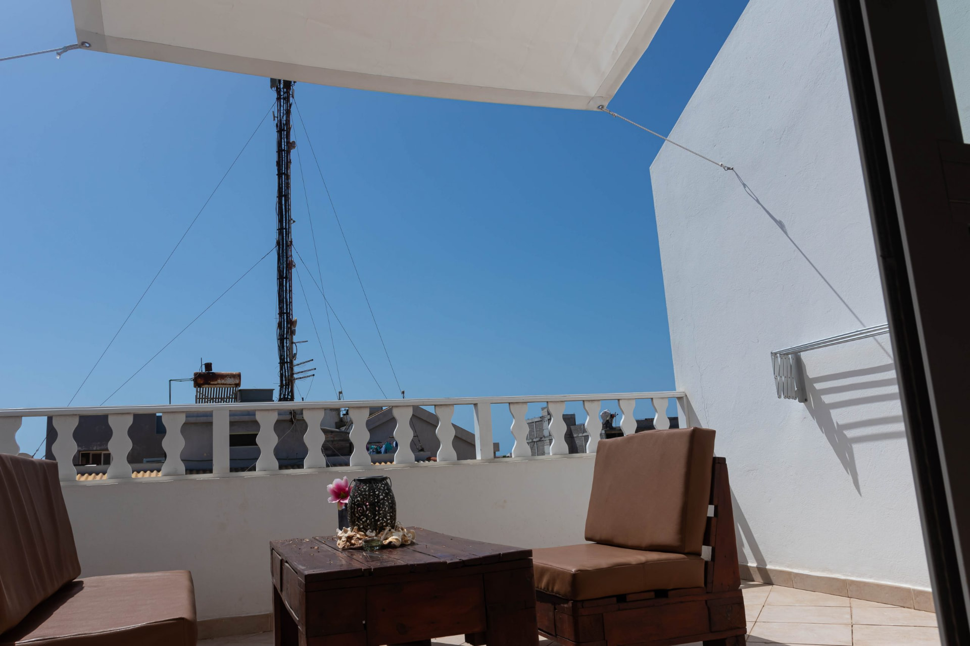 Santo Antão — shaded rooftop terrace lounge