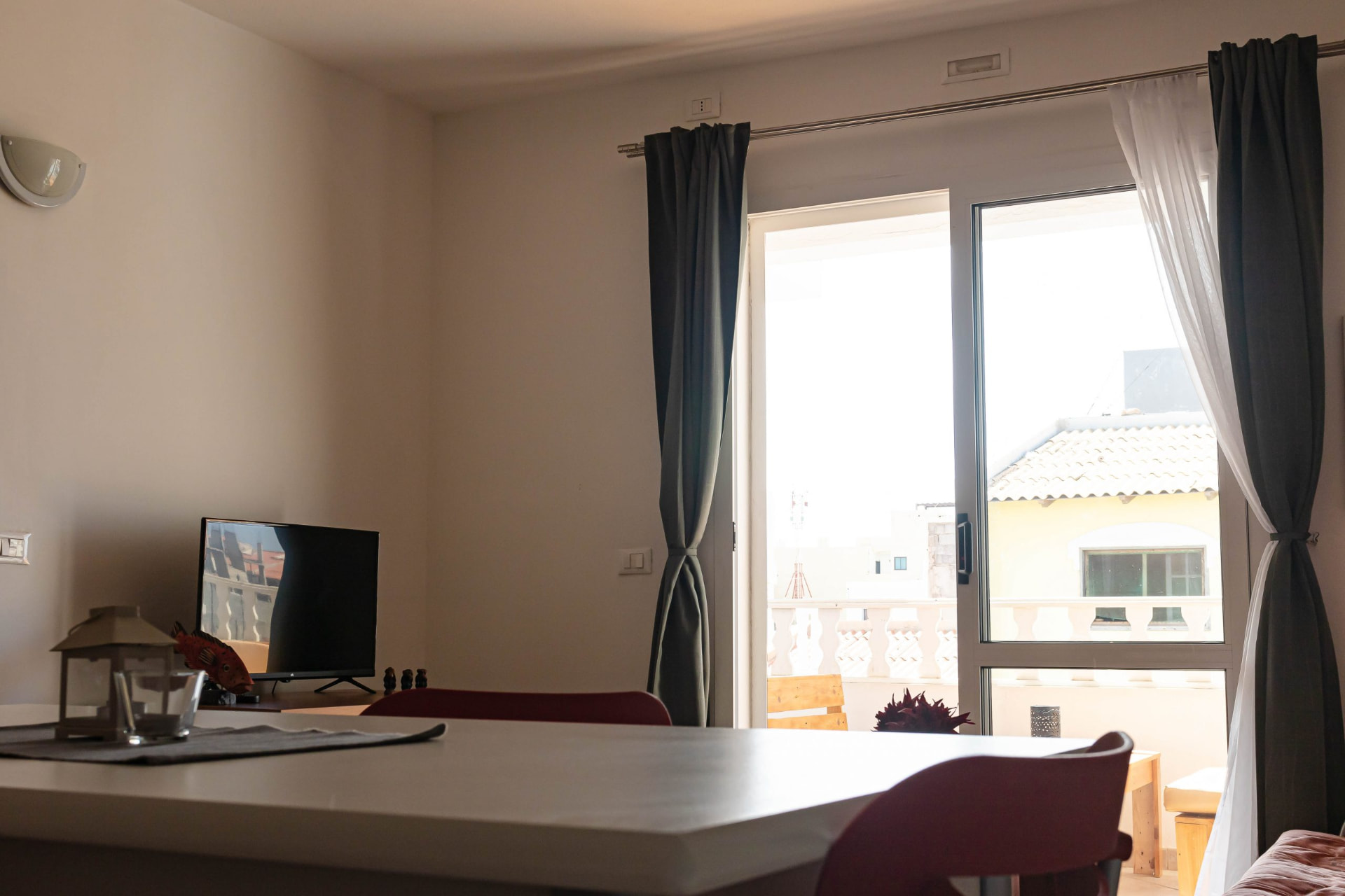 Santiago — dining area with balcony doors