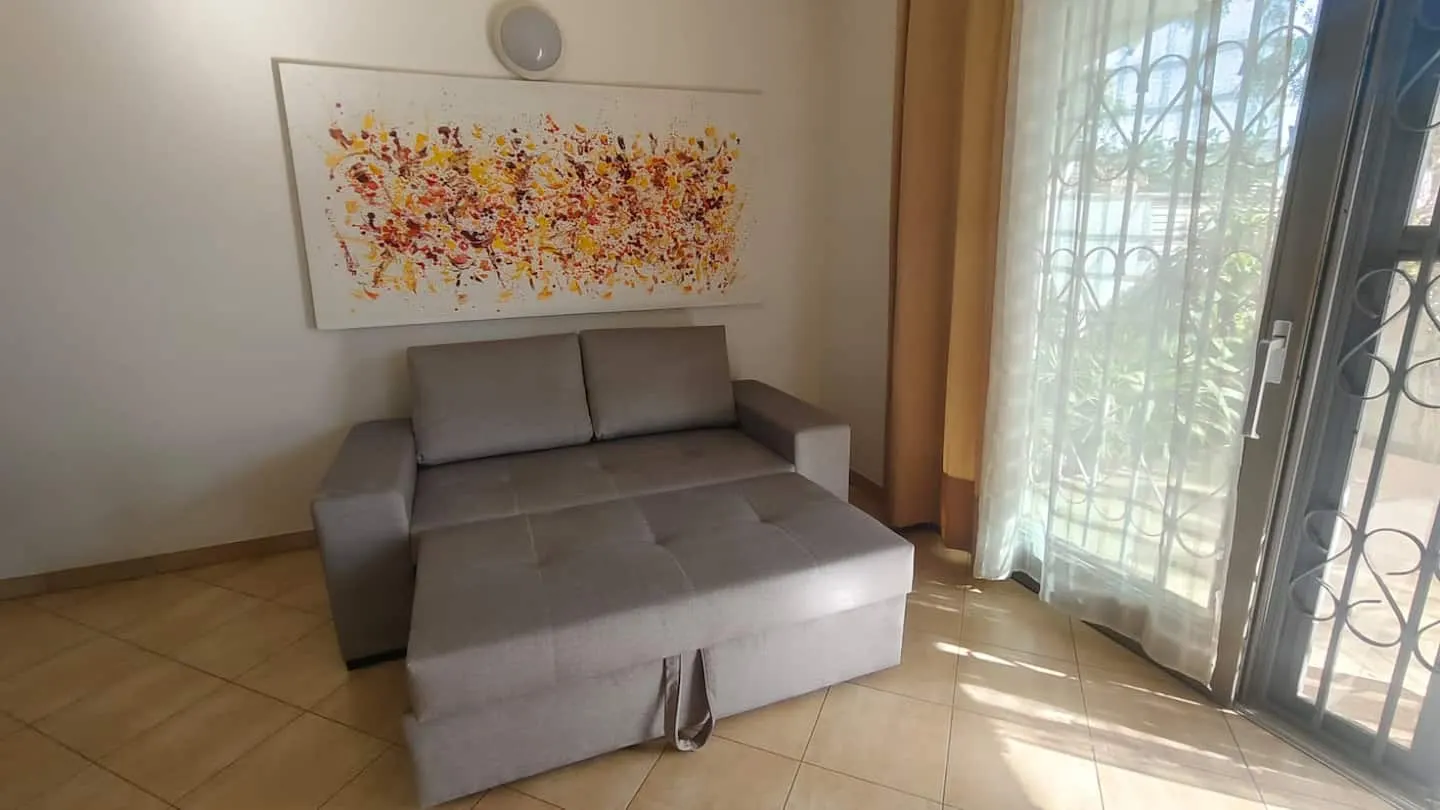 Meridiana Cozy Apartment — Living room
