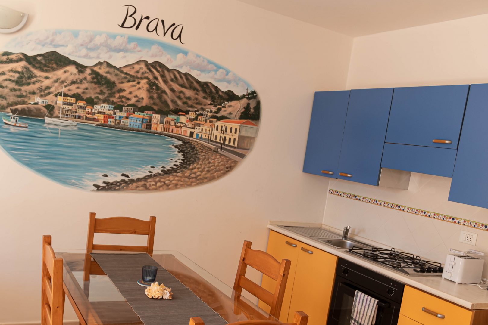 Brava — kitchen & dining with island mural