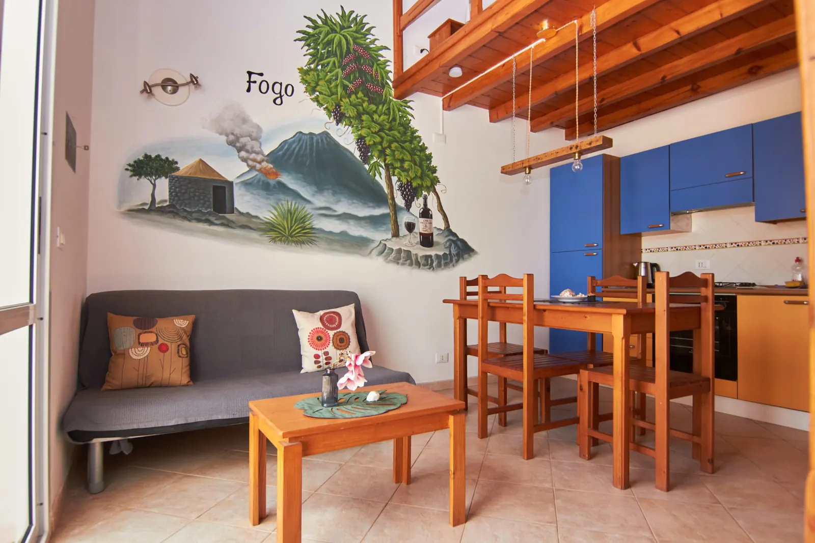Fogo — living room with hand-painted Fogo volcano mural